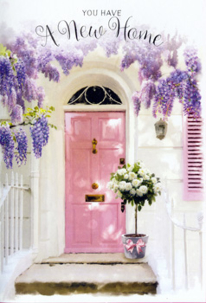 Here, a modest London doorway in Lisson Grove becomes a poetic vignette of homecoming and hope. The door itself is painted a gentle, powdery pink, its surface softly matte rather than glossy, which allows the light to settle on it like a blush rather than a shine. Flanking the doorway, the walls are whitewashed and subtly textured, catching tiny shadows that hint at old brick beneath the paint, typical of the character homes tucked just off the main roads near St John's Wood. Overhead, wisteria tumbles down in waterfalls of lavender, lilac, and dusky purple, threads of green vine weaving in and out like loosely braided ribbons. The flowers create a semi-transparent curtain, scattering small specks of light across the doorstep and giving the scene a sheltered, intimate feel, as if you're peeking into a private moment. At the foot of the door, a sturdy tin-style bucket in a soft stone-grey tone holds a lush bouquet of white and cream roses. The roses are full-headed and soft, with gently cupped petals, arranged in a way that feels both composed and natural, as though the florist wanted them to look as if they had simply settled into place. Around them, sprigs of muted green foliage fill in the gaps, their leaves adding structure without overpowering the gentle palette. A satin-finish ribbon in blush pink is tied carefully around the bucket, its tails resting casually on the step. The impression is one of a housewarming gift just delivered-a thoughtful floral gesture from someone who knows the rhythm of local life in Lisson Grove-capturing the excitement, vulnerability, and quiet joy of turning a new key in a fresh front door.